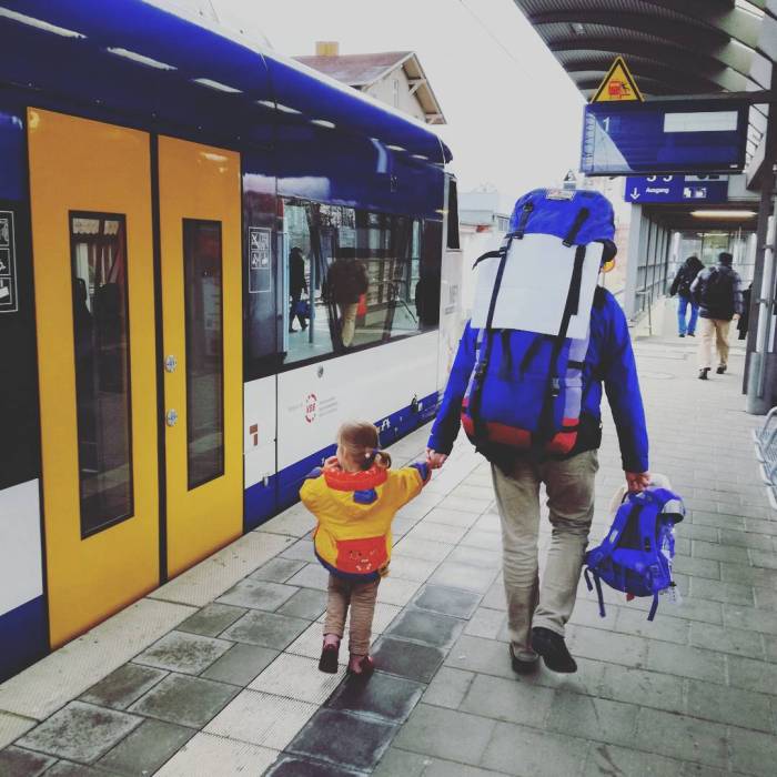 Street Photo of a random colour match of travelers and the train station in Angermünde