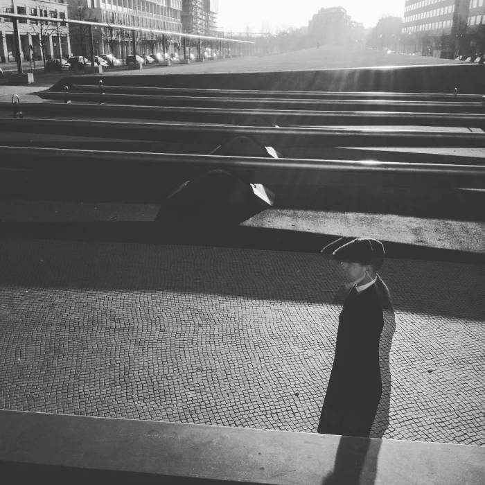 Man walking passed the Potsdamer Platz Sea Saws in Berlin