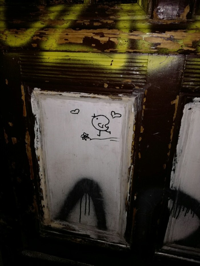 Love bird street art at Neukölln Rixdorf house door.