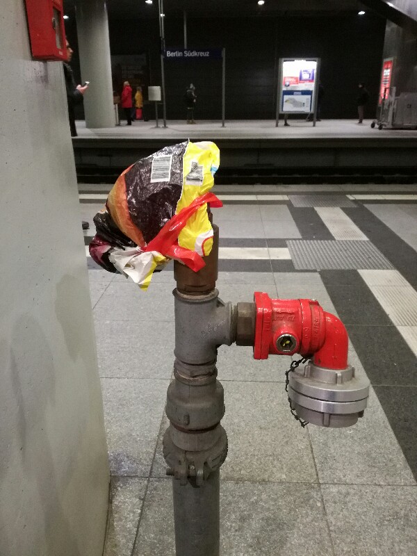 Plastic bag repairment of leaking Deutsche Bahn fire hydrant