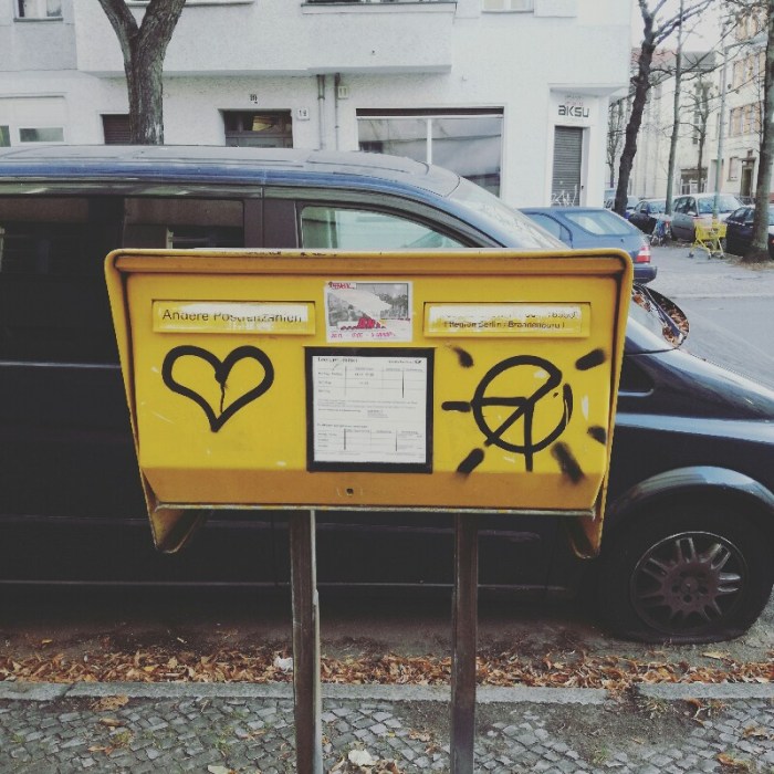 Street art photo of mailbox full of Peace and Love (street art in Panierstraße, Berlin Neukölln)