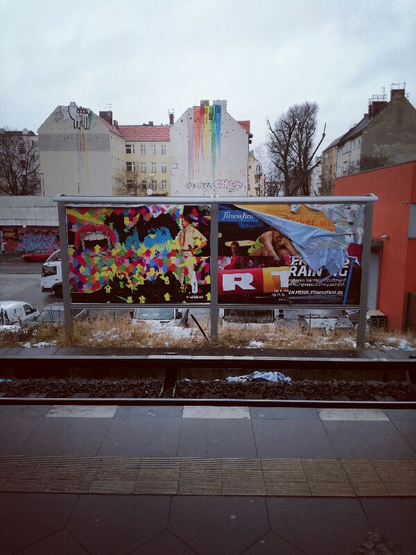 Streetart and advertising posters at trainstation Berlin Neukölln by Stefan Klenke